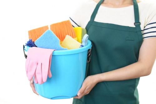 Carpet cleaning technician working safely in an Isleworth property