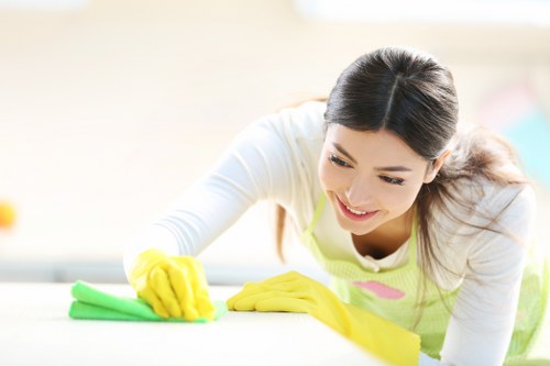 Eco-friendly carpet cleaning team sorting recyclable materials in Isleworth