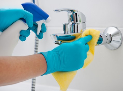 Technician managing cleaning waste responsibly after a carpet service